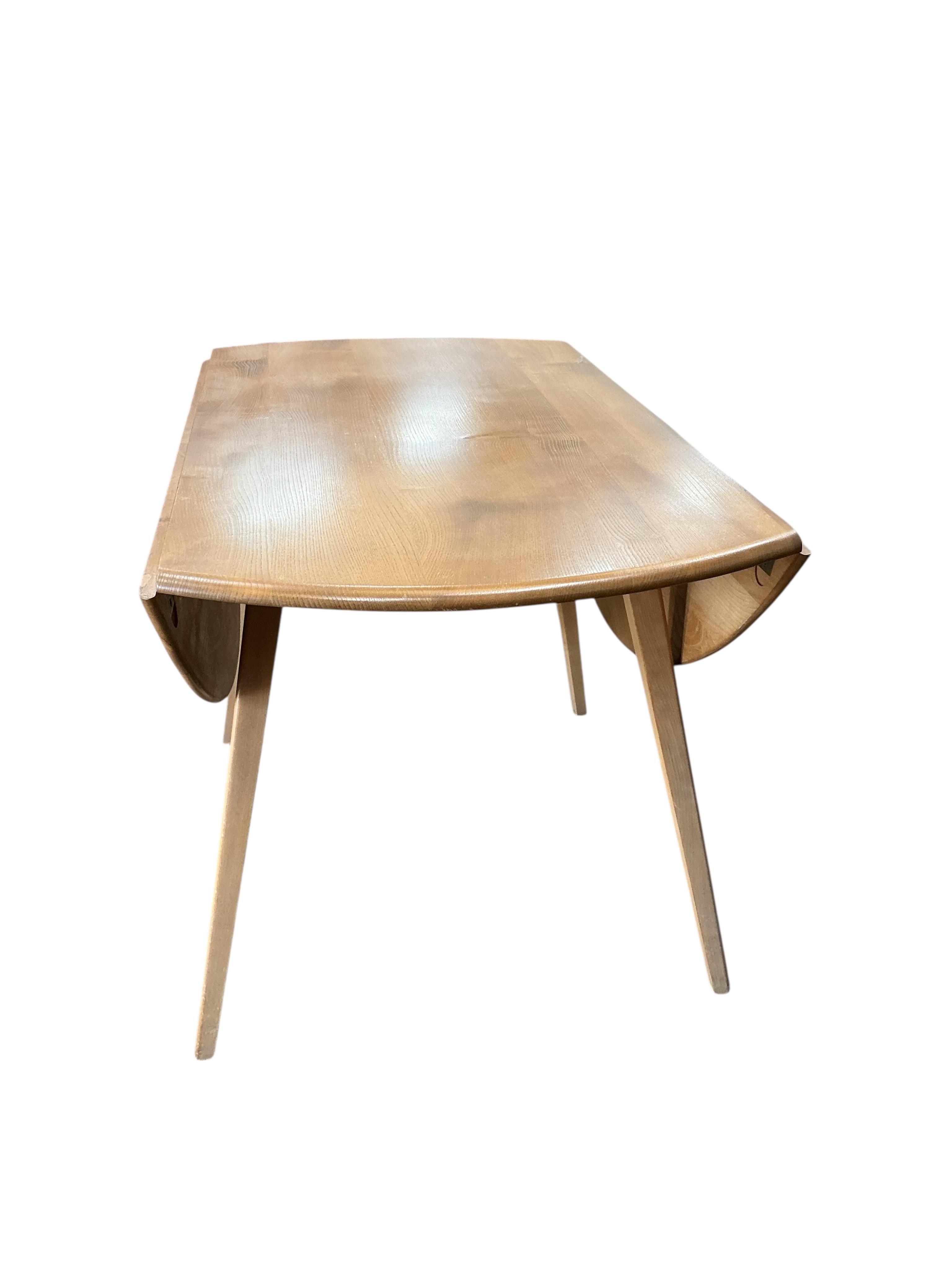 An Ercol light elm drop leaf dining table, width 112cm, depth 64cm, height 72cm